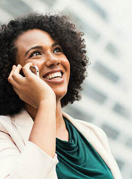 Smiling woman talking on phone